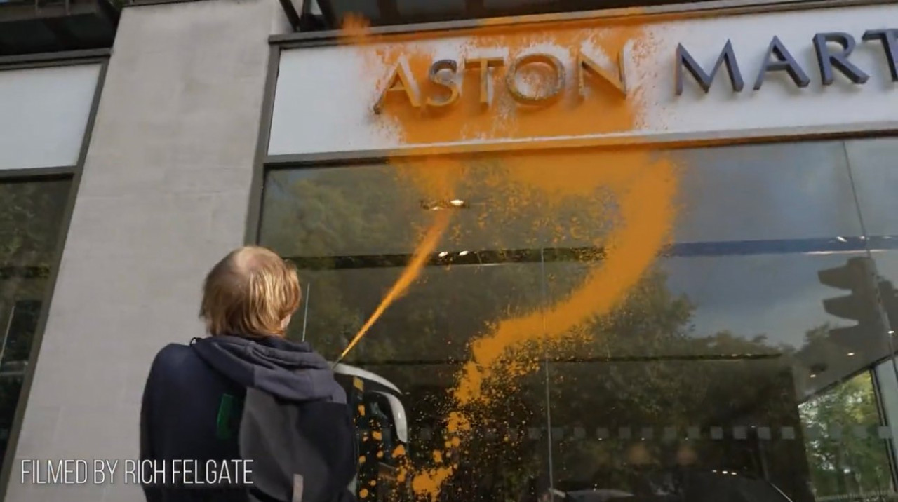 Unhinged Climate Activist Vandalizes Luxury Car Aston Martin Dealership with Paint to Protest Oil Production (VIDEO)