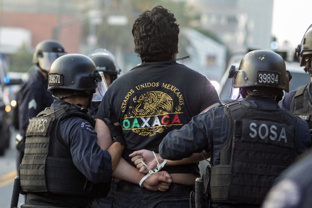 WATCH: L.A. Police Detain Reporter Live On-Air During Anti-ICE Riots
