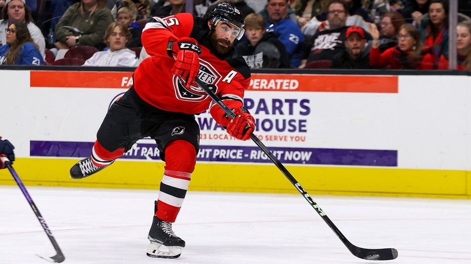 AHL hockey player scores goal after being hit in mouth by puck