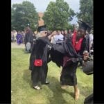 “All About Me!”- College Graduate Gets into Scuffle with Educator and Snatches Mic Away – Then Plays the Race Card (VIDEO)