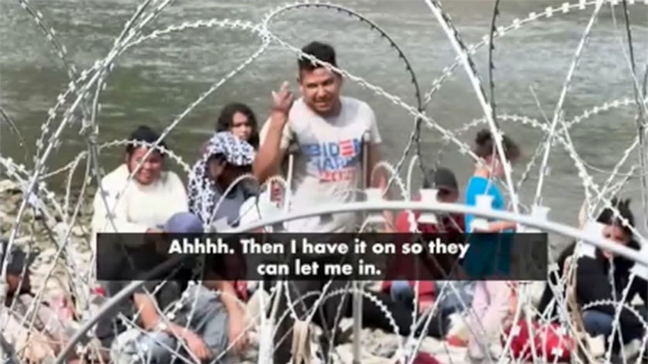 Migrant at U.S.-Mexico border wears Biden-Harris shirt, claims not to know who they are