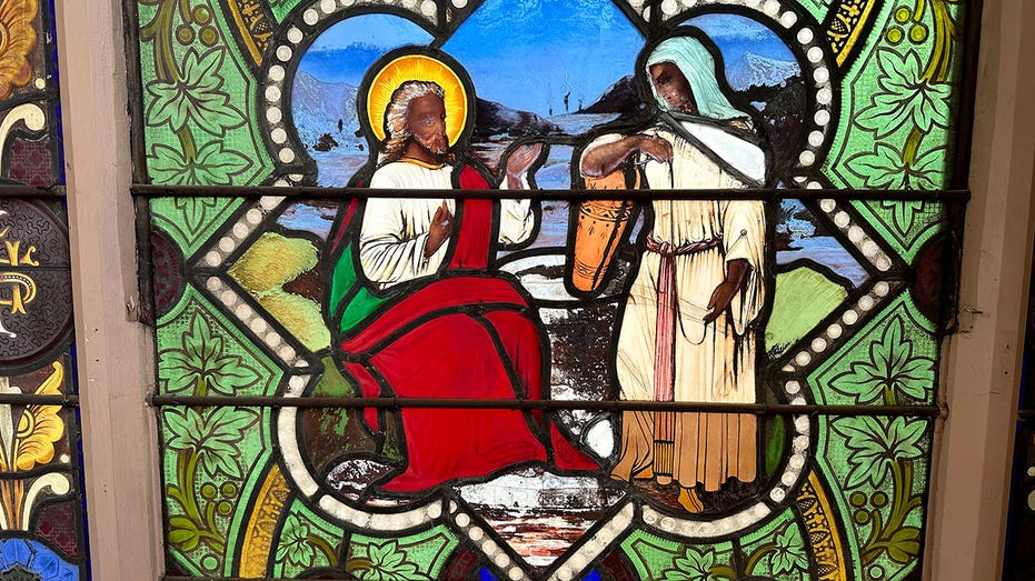 Dark-skinned Jesus on stained-glass church window from 1870s prompts debate on Christ's race