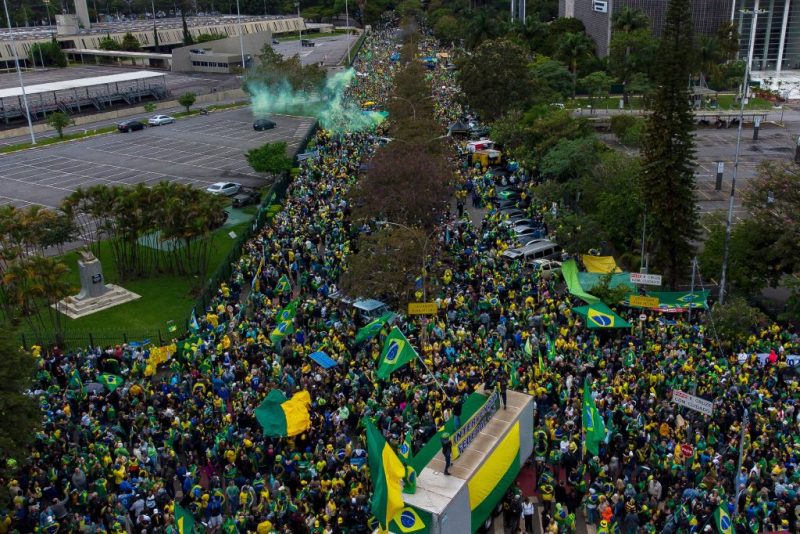 Aerial view of supporters of Brazilian President Jair Bolsonaro taking part in a protest to ask for federal intervention outside Brazil's Armed Forces Headquarters in Sao Paulo, Brazil, on November 2, 2022. - Thousands of Bolsonaristas gathered this Wednesday in front of Army commands in the main cities of Brazil to ask for a military intervention in the face of the victory of leftist Lula da Silva at the polls. (Photo by Miguel SCHINCARIOL / AFP) (Photo by MIGUEL SCHINCARIOL/AFP via Getty Images)