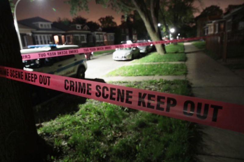 Crime scene tape is stretched around the front of a home where a man was shot on May 28, 2017 in Chicago, Illinois. Chicago police have added more than 1,000 officers to the streets over the Memorial Day weekend, hoping to put a dent in crime, during what is typically one of the more violent weekends of the year. In 2016, 6 people were killed and another 65 were wounded by gun violence over the Memorial Day weekend. (Photo by Scott Olson/Getty Images)