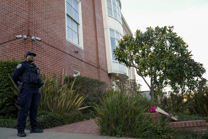 A police officer stands outside the home of House Speaker Nancy Pelosi and her husband Paul Pelosi in San Francisco, Friday, Oct. 28, 2022. Paul Pelosi, was attacked and severely beaten by an assailant with a hammer who broke into their San Francisco home early Friday, according to people familiar with the investigation. (AP Photo/Godofredo A. Vásquez)
