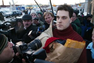 UNITED STATES - FEBRUARY 14: Robert Chambers, wearing a red sweater on a chilly Valentine's Day and clutching a paper bag, brushes past reporters and cameras upon his release from Auburn Correctional Facility this morning. Chambers, the so-called