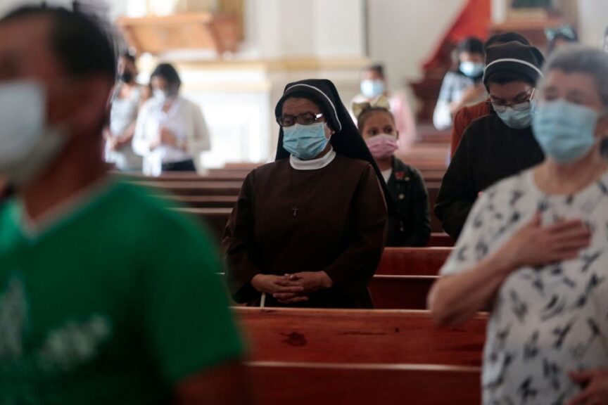 People pray during a mass at the Matagalpa Cathedral in Matagalpa, Nicaragua, on August 19, 2022. - Nicaraguan police on August 19, 2022 forcefully removed Catholic bishop and government critic Rolando Alvarez from his official residence after two weeks under siege, said Church and rights groups who had no news on his whereabouts. (Photo by OSWALDO RIVAS / AFP) (Photo by OSWALDO RIVAS/AFP via Getty Images)