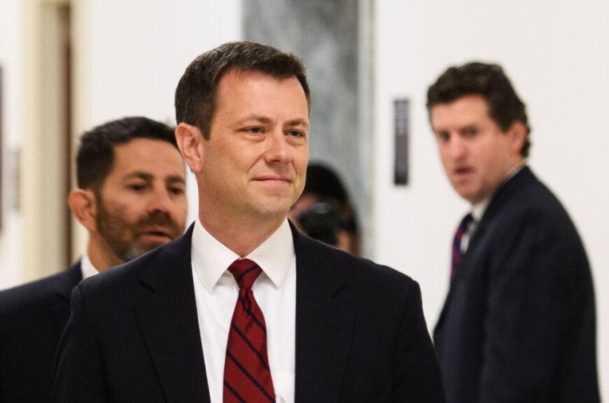 FBI agent Peter P. Strzok(C) arrives for a full committee meeting on 