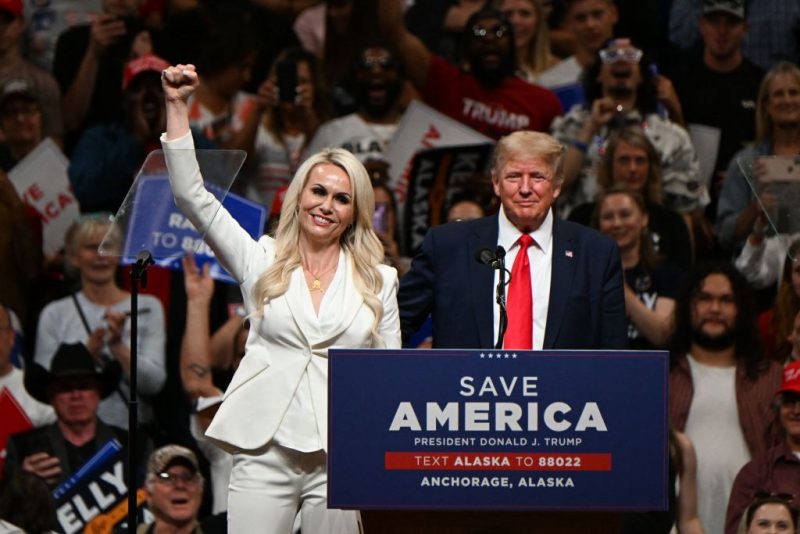 US Senate candidate Kelly Tshibaka (L) speaks alongside former US President Donald Trump during a "Save America" rally campaigning in support of republican candidates in Anchorage, Alaska on July 9, 2022. (Photo by Patrick T. FALLON / AFP) (Photo by PATRICK T. FALLON/AFP via Getty Images)