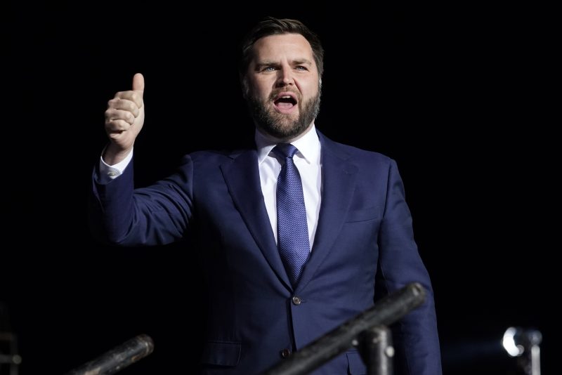 Ohio Senate candidate JD Vance arrives to speak before former President Donald Trump at a campaign rally at Wright Bros. Aero Inc. at Dayton International Airport on Monday, Nov. 7, 2022, in Vandalia, Ohio. (AP Photo/Michael Conroy)