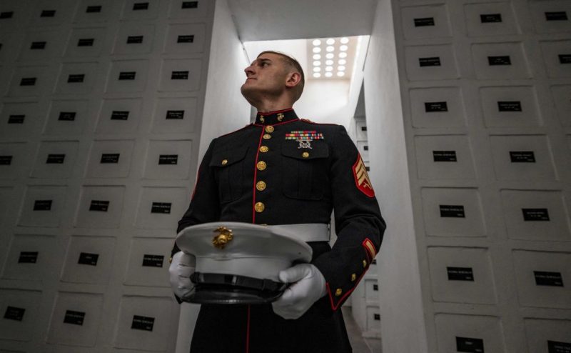 A US marine corps serviceman walks in the French Crypt next to the