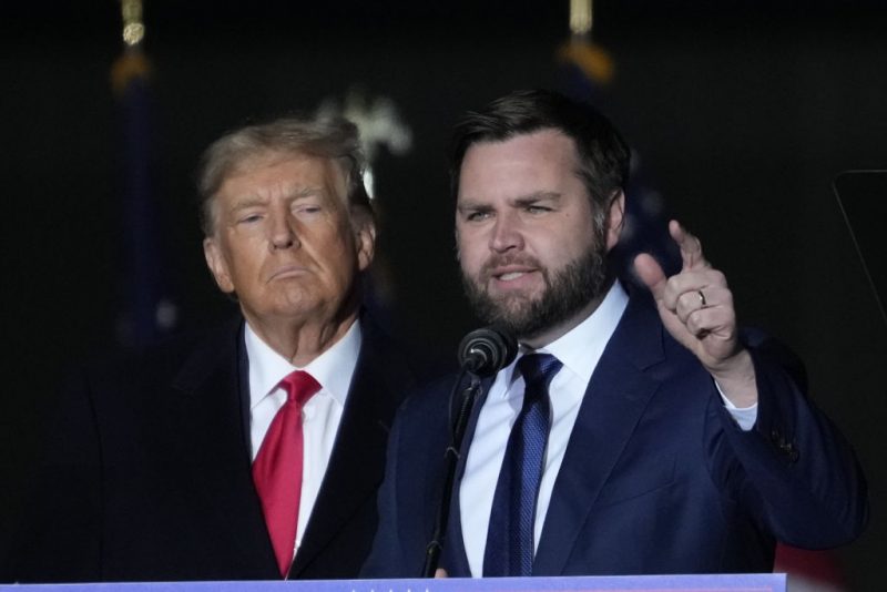 VANDALIA, OHIO - NOVEMBER 07: Former U.S. President Donald Trump and Republican candidate for U.S. Senate JD Vance greet supporters during the rally at the Dayton International Airport on November 7, 2022 in Vandalia, Ohio. Trump campaigned at the rally for Ohio Republican candidates including Republican candidate for U.S. Senate JD Vance, who is running in a tight race against Democratic candidate for U.S. Senate Rep. Tim Ryan (D-OH). (Photo by Drew Angerer/Getty Images)