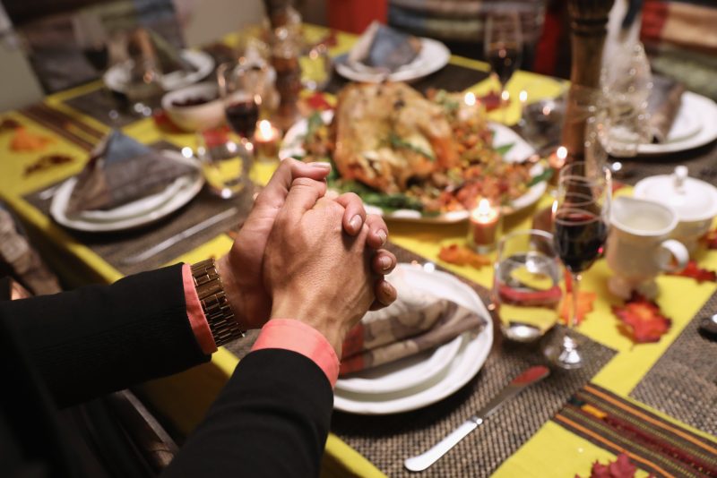 STAMFORD, CT - NOVEMBER 24: Central American immigrants and their families pray before Thanksgiving dinner on November 24, 2016 in Stamford, Connecticut. Family and friends, some of them U.S. citizens, others on work visas and some undocumented immigrants came together in an apartment to celebrate the American holiday with turkey and Latin American dishes. They expressed concern with the results of the U.S. Presidential election of president-elect Donald Trump, some saying their U.S.-born children fear the possibilty their parents will be deported after Trump's inauguration. (Photo by John Moore/Getty Images)