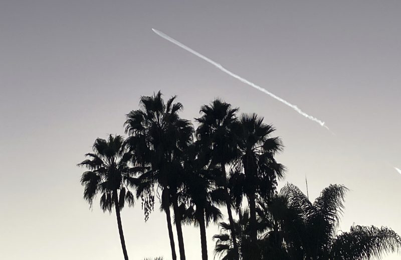 A SpaceX Falcon 9 rocket streaks across the sky, as seen from Pasadena, after launching from Vandenberg Space Force Base, Calif., carrying 53 Starlink satellites into orbit, Thursday, Oct. 27, 2022. (AP Photo/John Antczak)