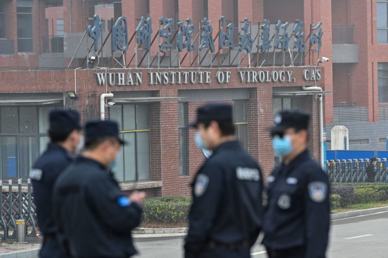Security personnel stand guard outside the Wuhan Institute of Virology in Wuhan as members of the World Health Organization (WHO) team investigating the origins of the COVID-19 coronavirus make a visit to the institute in Wuhan in China's central Hubei province on February 3, 2021. (Photo by Hector RETAMAL / AFP) (Photo by HECTOR RETAMAL/AFP via Getty Images)