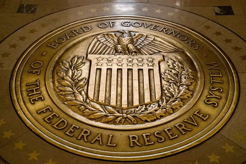 FILE- In this Feb. 5, 2018, file photo, the seal of the Board of Governors of the United States Federal Reserve System is displayed in the ground at the Marriner S. Eccles Federal Reserve Board Building in Washington. The Federal Reserve reinforced its inflation fight Wednesday, Dec. 14, 2022, by raising its key interest rate for the seventh time this year and signaling more hikes to come. But the Fed announced a smaller hike than it had in its past four meetings at a time when inflation is showing signs of easing. (AP Photo/Andrew Harnik, File)