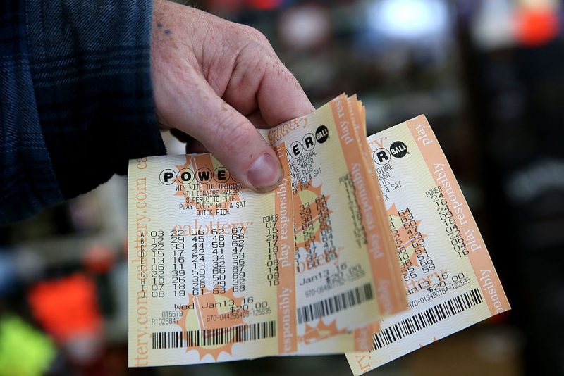 SAN LORENZO, CA - JANUARY 13: A customer holds a handful of Powerball tickets at Kavanagh Liquors on January 13, 2016 in San Lorenzo, California. Dozens of people lined up outside of Kavanagh Liquors, a store that has had several multi-million dollar winners, to -purchase Powerball tickets in hopes of winning the estimated record-breaking $1.5 billion dollar jackpot. (Photo by Justin Sullivan/Getty Images)