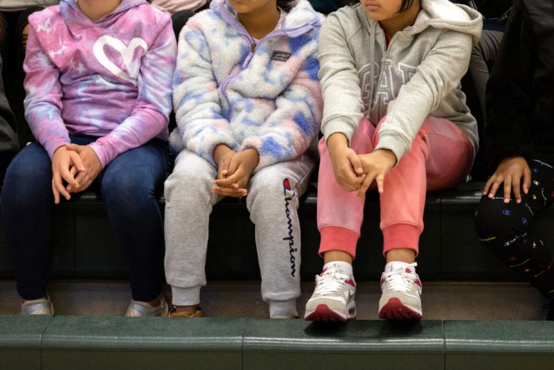 Eighth grade students listen to a police lecture on internet safety and cyberbullying at the Scofield Magnet Middle School on October 24, 2022 in Stamford, Connecticut. Police officers from the Stamford Police department's community outreach program have been addressing students citywide at the invitation of school administrators. The Centers for Disease Control (CDC) reports that student incidents of cyberbullying are highest in middle schools, and children ages 11-14 spend an average of 9 hours of screen time per day nationwide. (Photo by John Moore/Getty Images)