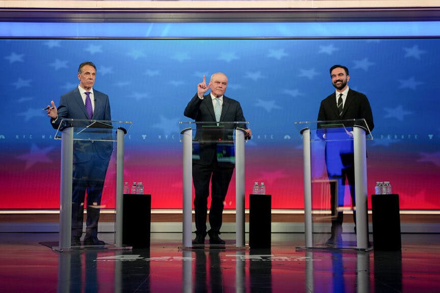 Andrew Cuomo, New York City mayoral candidate, from left, Curtis Sliwa, New York City mayoral candidate, and Zohran Mamdani, New York City mayoral candidate, during a mayoral debate in New York, US, on Thursday, Oct. 16, 2025. Millions of dollars are pouring into the mayoral election with less than four weeks to go until New Yorkers go to the polls. Photographer: Angelina Katsanis/AP Photo/Bloomberg via Getty Images