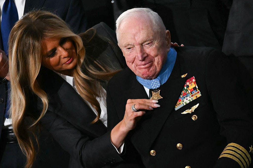 US First Lady Melania Trump presents US veteran Captain E. Royce Williams with the Medal of Honor during US President Donald Trump's the State of the Union address in the House Chamber of the US Capitol in Washington, DC, on February 24, 2026.