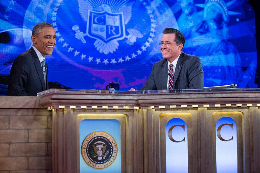 WASHINGTON, DC - DECEMBER 8: (AFP OUT) U.S. President Barack Obama (L) talks to television personality Stephen Colbert during a taping of Comedy Central's