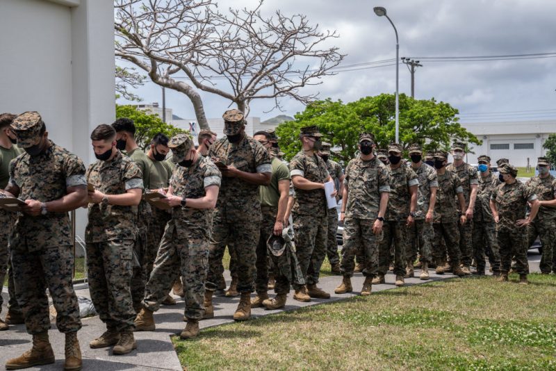 KIN, JAPAN - APRIL 28: United States Marines queue to receive the Moderna coronavirus vaccine at Camp Hansen on April 28, 2021 in Kin, Japan. A United States military vaccination program aiming to inoculate all service personnel and their families against Covid-19 coronavirus is under way on Japans southernmost island of Okinawa, home to around 30,000 US troops and one of the largest US Marine contingents outside of mainland USA. (Photo by Carl Court/Getty Images)