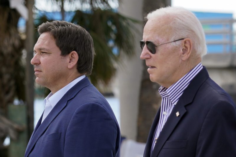 President Joe Biden and Florida Gov. Ron DeSantis arrive to tour an area impacted by Hurricane Ian on Wednesday, Oct. 5, 2022, in Fort Myers Beach, Fla. (AP Photo/Evan Vucci)