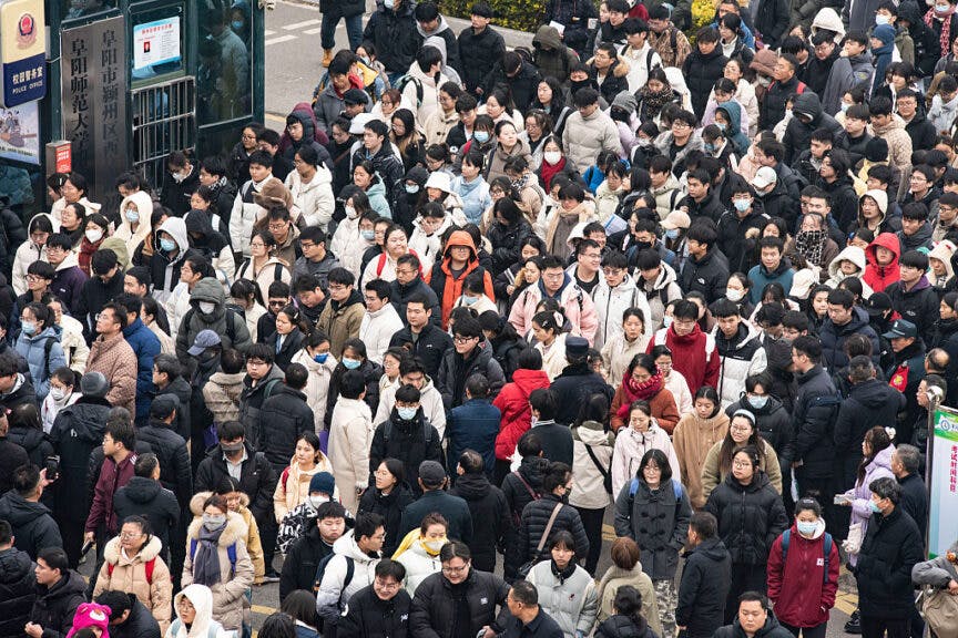 FUYANG, CHINA - DECEMBER 20: Examinees walk out of an examination site for the 2026 postgraduate entrance exam on December 20, 2025 in Fuyang, Anhui Province of China. 2026 China's national exam for postgraduate enrolment kicked off on December 20. (Photo by VCG/VCG via Getty Images)