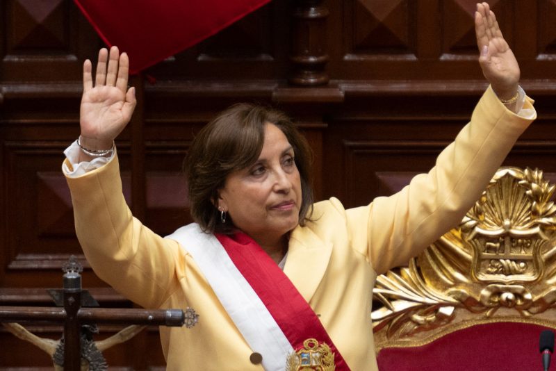 Peruvian Dina Boluarte greets members of the Congress after being sworn in as the new President hours after former President Pedro Castillo was impeached in Lima, on December 7, 2022. - Peru's Pedro Castillo was impeached and replaced as president by his deputy on Wednesday in a dizzying series of events in the country that has long been prone to political upheaval. Dina Boluarte, a 60-year-old lawyer, was sworn in as Peru's first female president just hours after Castillo tried to wrest control of the legislature in a move criticised as an attempted coup. (Photo by Cris BOURONCLE / AFP) (Photo by CRIS BOURONCLE/AFP via Getty Images)