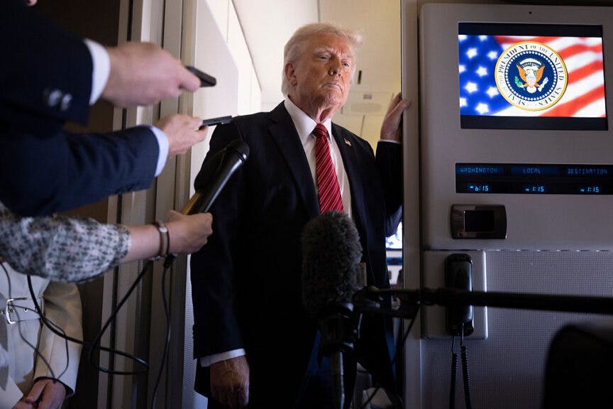 US President Donald Trump listens to questions as he speaks to members of the press on Air Force One while flying over Saudi Arabia on his way to Qatar on May 14, 2025. (Photo by Brendan Smialowski / AFP) (Photo by BRENDAN SMIALOWSKI/AFP via Getty Images)